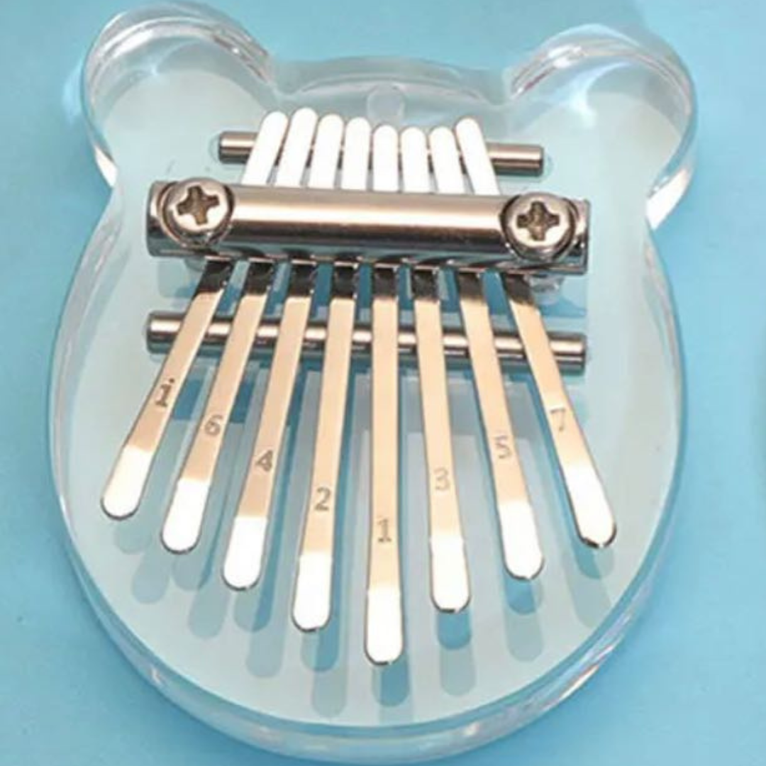 Átlátszó akril mini Kalimba gravírozott hangjegyekkel, hordozható és modern.